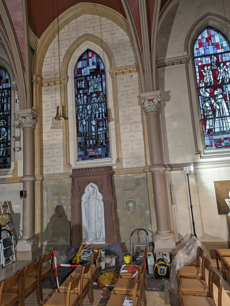 The frescoes on the wall above the tomb of Bishop Nicolas Adames have been completely uncovered.
